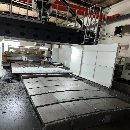 []纽威4米龙门，工作台2.5米4米，门宽3.3米，门高1.7米.